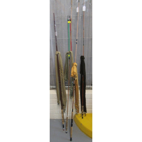 427 - Collection of vintage carbon and split cane fishing rods, all in original canvas bags, to include: B... 