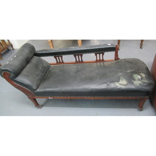 459 - Edwardian mahogany framed and leather chaise longue on tapering legs and casters.
(B.P. 21% + VAT)