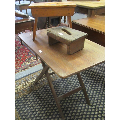 477 - Rustic elm and pine stools with handholds, together with folding table of rectangular form. (3)
(B.P... 