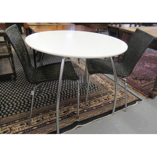 479 - Mid 20th century white melamine circular table on chrome legs together with a pair of black caned ch... 