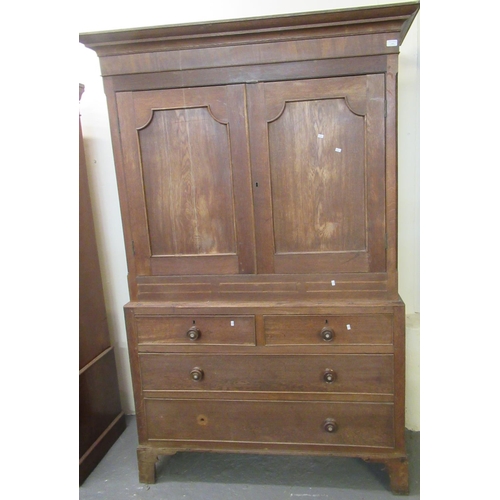 493 - 19th Century Welsh oak press cupboard, with moulded cornice above two blind panelled doors, projecti... 