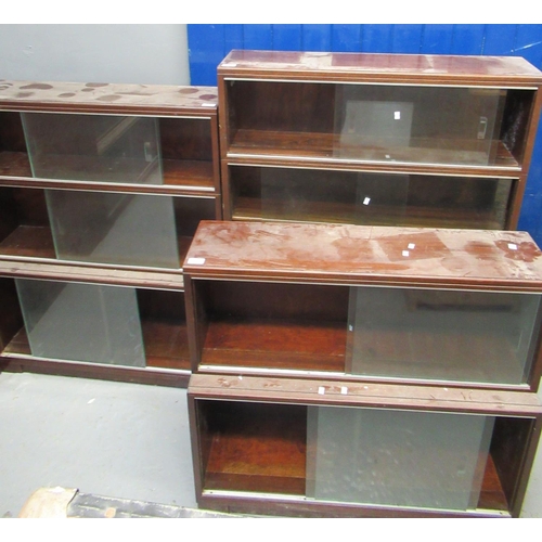 497 - Two similar mid Century Minty mahogany three sectional bookcases with glass sliding doors, together ... 