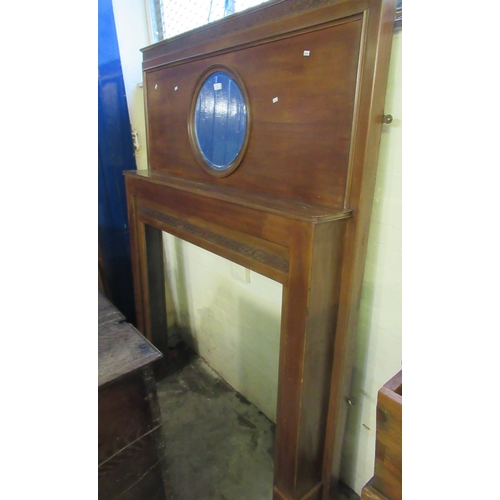 503 - Early 20th century mahogany fire surround with circular bevelled mirror and strapwork banding.  (B.P... 