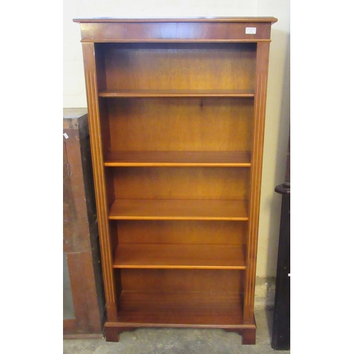 511 - Reproduction yew finish open book case with four adjustable shelves. 76cm wide approx.   (B.P. 21% +... 