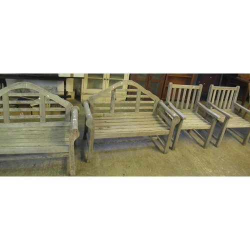 519 - Collection of teak garden furniture to include two Lutyens style benches, pair of armchairs and a vi... 