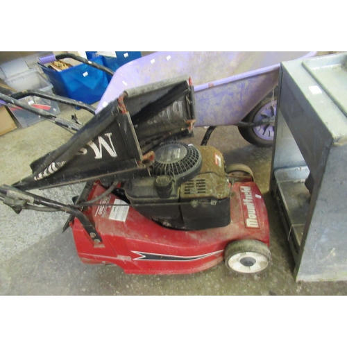 521 - A garden wheelbarrow together with an Eltex greenhouse heater and a Mountfield lawn mower in very di... 