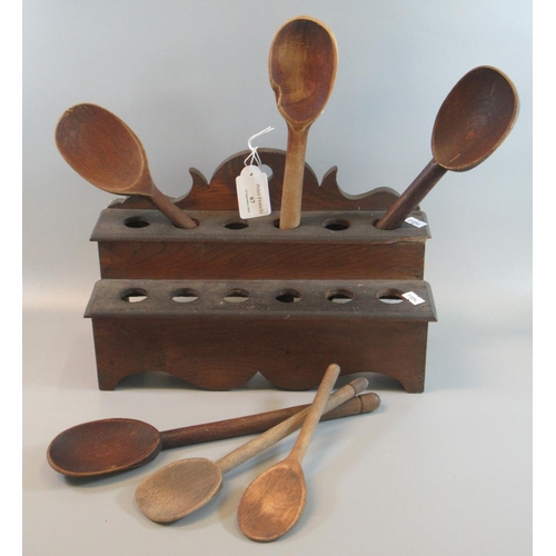 67 - 19th Century traditional Welsh oak two tier spoon rack with six cawl spoons. 
(B.P. 21% + VAT)