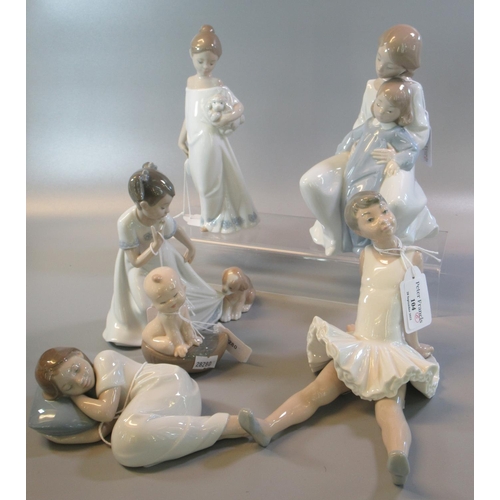 104 - Five Nao Spanish porcelain figurines/figure groups of young girls, a seated ballerina, puppy etc. To... 