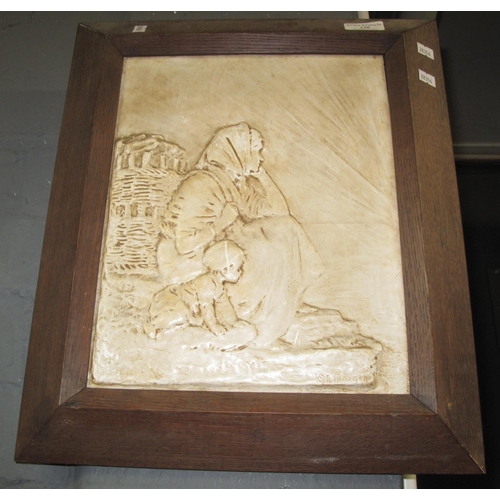 130 - Early 20th Century plaster panel of a fish wife and child sitting on a quayside, indistinctly signed... 