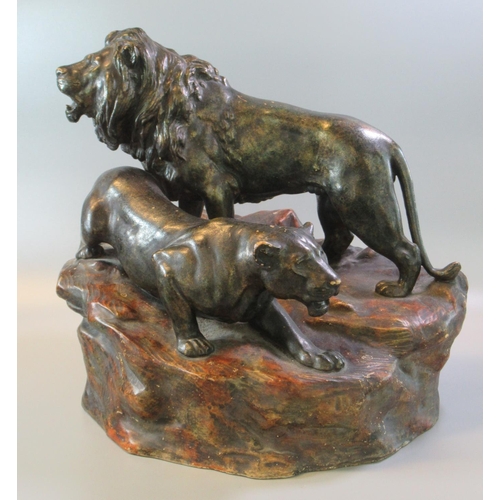 14 - Early 20th century bronzed study of a male and female lion on naturalistic base.  (B.P. 21% + VAT)