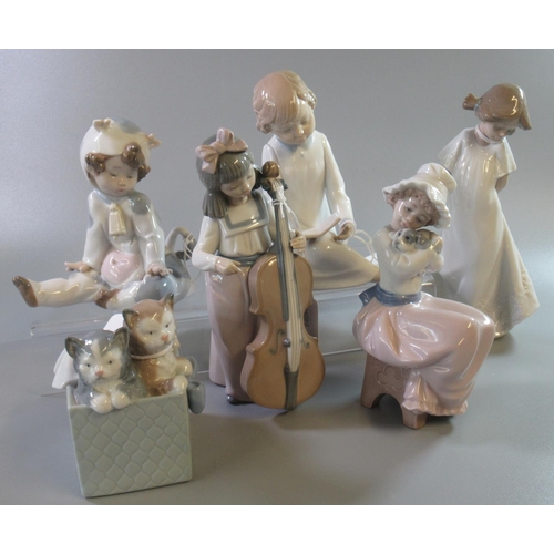 166 - Five Nao Spanish porcelain figurines of young children together with a Nao porcelain figure group of... 