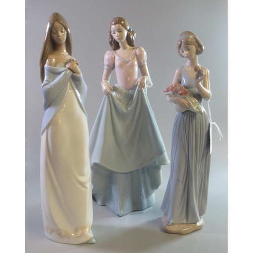 178 - Three Nao Spanish porcelain figurines of young girls with a basket of flowers, crinoline dress etc. ... 