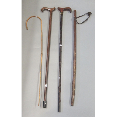 187 - Four walking sticks to include; a very thin Charlie Chaplin type bamboo cane. (4)
(B.P. 21% + VAT)