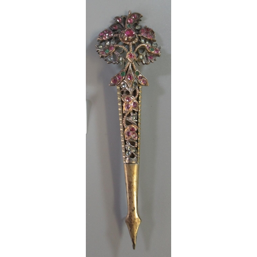 250 - White metal gem set dagger shaped pin brooch of pierced floral design.   (B.P. 21% + VAT)