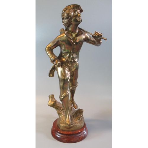 29 - Brass figure of a striding boy with a basket of grapes over his shoulder on a naturalistic base with... 