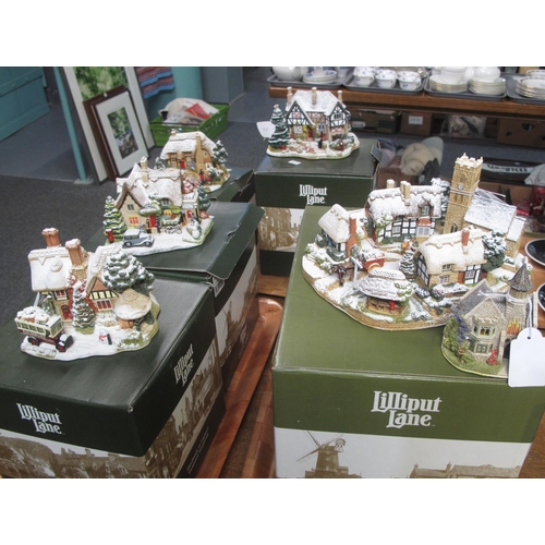 302 - Three trays of Lilliput Lane boxed items, mostly Christmas cottages to include; 'Christmas Eve', 'Ch... 