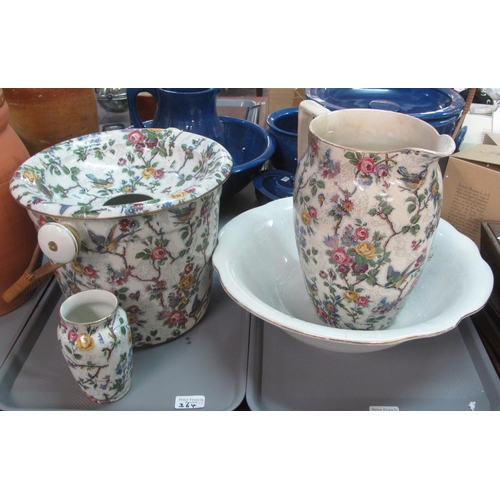 364 - Jug and basin set with pail (chamber pot) with basket ware handle and a small vase. (4)
(B.P. 21% + ... 