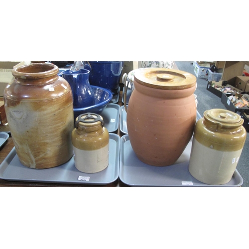 366 - Four earthenware pottery items: three two-tone brown lidded jars, terracotta pot with wooden lid and... 