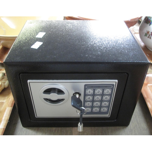 379 - Small lightweight black safe with combination lock and keys.
(B.P. 21% + VAT)