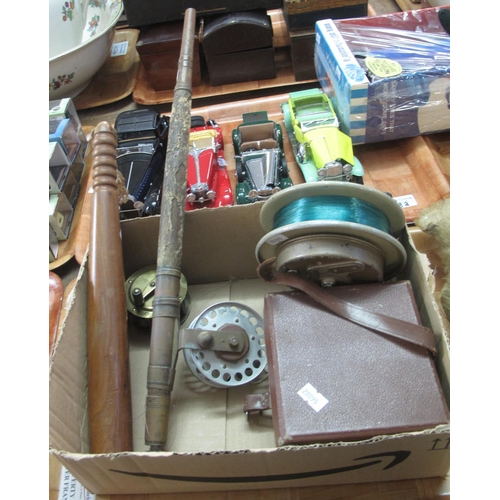 384 - Box containing collection of vintage fishing reels, wooden and brass reel in, possibly, original box... 