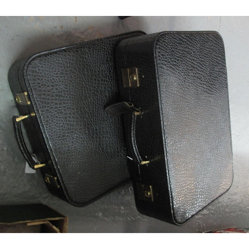 391 - Pair of matching imitation crocodile skin suitcases in black with brass fittings and red interiors. ... 