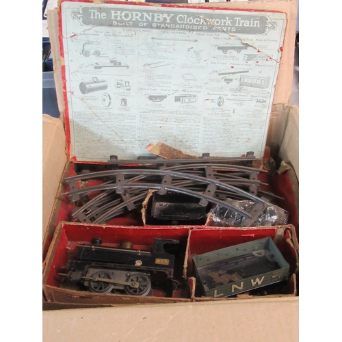 397 - A vintage Hornby tin plate clockwork train set in original distressed box, marked 'Train No. 1'.
(B.... 