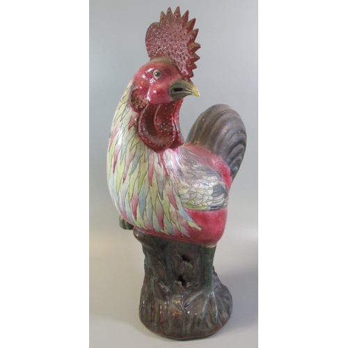 49 - Large Oriental stoneware cockerel in Chinese style with polychrome decoration.  39cm high approx.  (... 