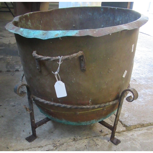 518 - Brass coal bin on wrought iron stand. 44cm diameter approx.
(B.P. 21% + VAT)