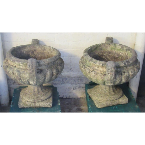 521 - Pair of reconstituted stone fluted two handled pedestal urn shaped garden planters. 45cm diameter ap... 