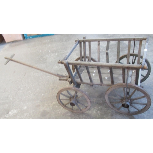 528 - Vintage four wheeled wooden dog cart or log cart. 
(B.P. 21% + VAT)