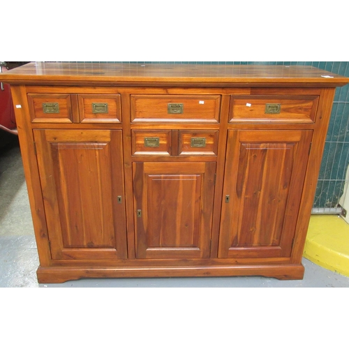 529 - Modern acacia wood sideboard or cabinet with four drawers and three shelved cupboards. Recessed bras... 