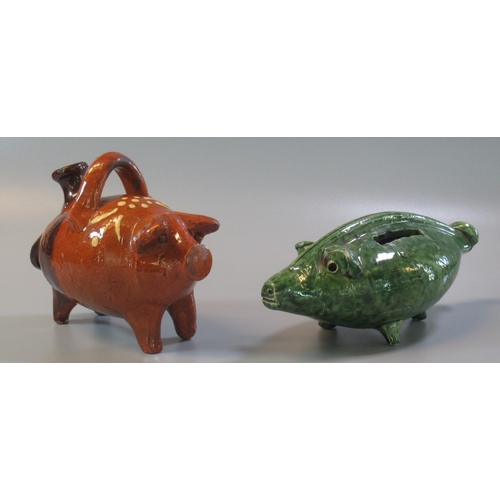 7 - In the style of 'Ewenny', a green glazed pottery zoomorphic money box in the form of a pig, together... 