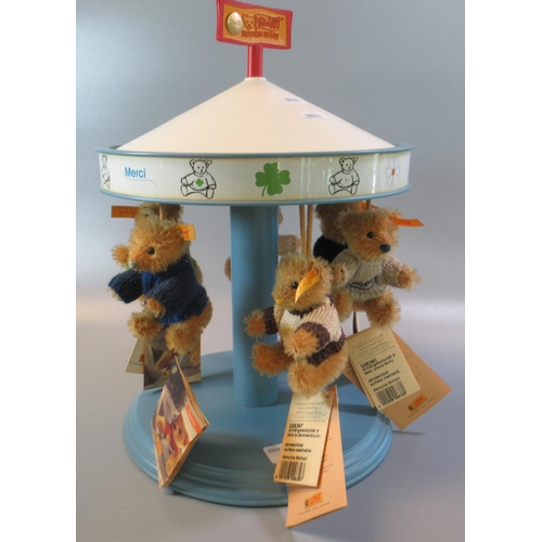 89 - Steiff display carrousel together with six  Stieff miniature bears.  (B.P. 21% + VAT)