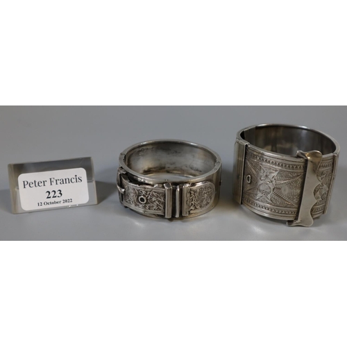 223 - Two Victorian unmarked silver buckle cuff bangles.  2.68 troy ozs approx.  (B.P. 21% + VAT)