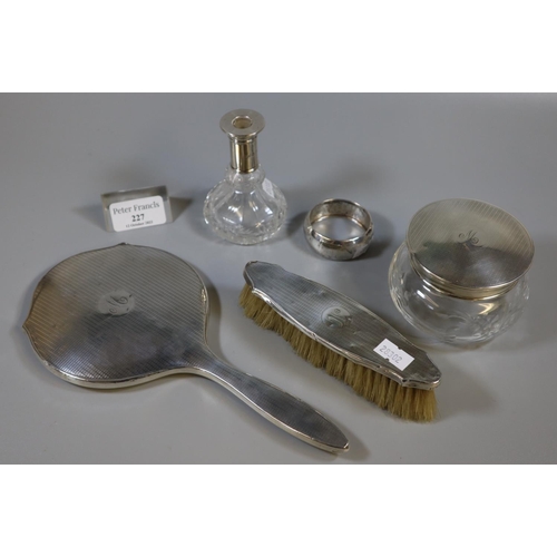 227 - Collection of assorted silver vanity items, to include: hand mirror, brush, jar and cover, together ... 