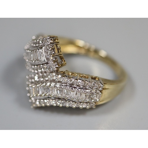 234 - 9ct gold and diamond dress ring in crossover setting.  Ring size K&1/2.  Approx weight 3.4 grams.
(B... 