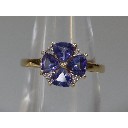 238 - 9ct gold tanzanite and diamond ring in flower head design.   Ring size L&1/2.  Approx weight 2.2 gra... 