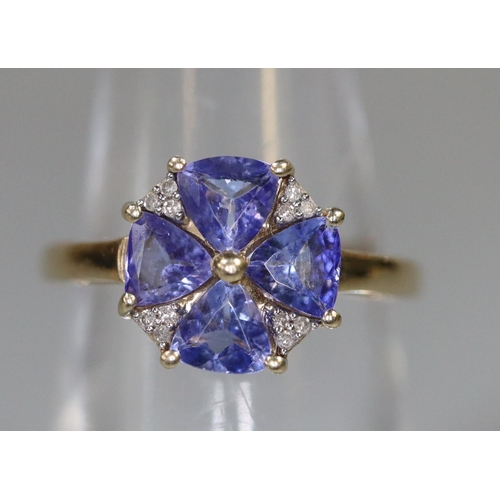 238 - 9ct gold tanzanite and diamond ring in flower head design.   Ring size L&1/2.  Approx weight 2.2 gra... 