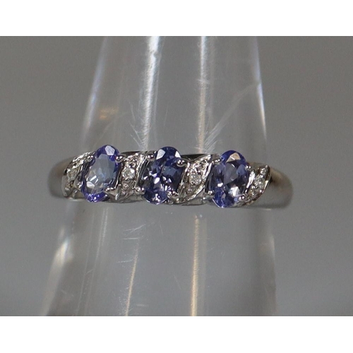 239 - 9ct white gold tanzanite and diamond ring.  Ring size N&1/2.  Approx weight 2.8 grams.  
(B.P. 21% +... 