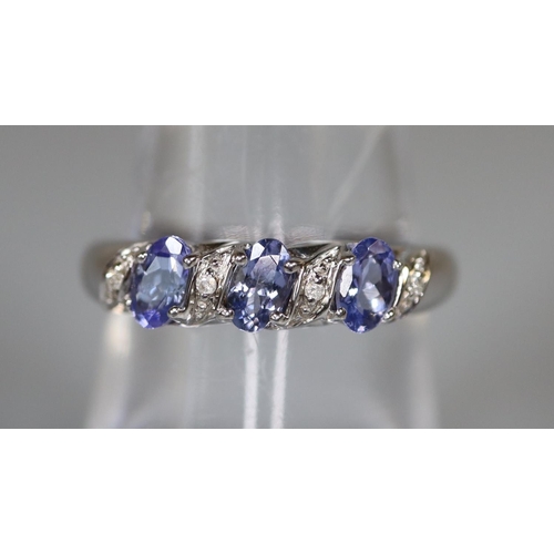 239 - 9ct white gold tanzanite and diamond ring.  Ring size N&1/2.  Approx weight 2.8 grams.  
(B.P. 21% +... 