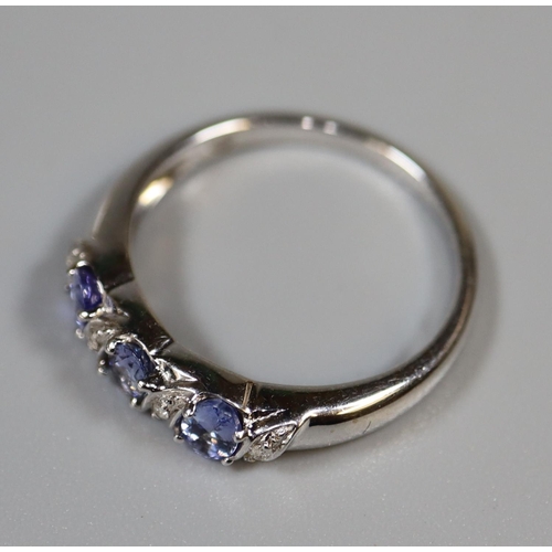 239 - 9ct white gold tanzanite and diamond ring.  Ring size N&1/2.  Approx weight 2.8 grams.  
(B.P. 21% +... 