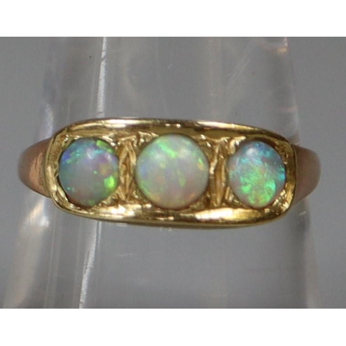 244 - Three stone opal ring set in yellow metal.  Ring size O&1/2.  Approx weight 2.4 grams.
(B.P. 21% + V... 