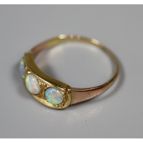 244 - Three stone opal ring set in yellow metal.  Ring size O&1/2.  Approx weight 2.4 grams.
(B.P. 21% + V... 