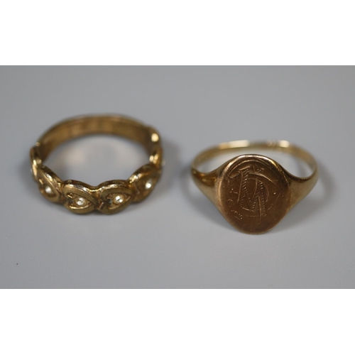 255 - 9ct gold signet ring.  Ring size Q.  Approx weight 2.4 grams.  Together with a costume jewellery rin... 