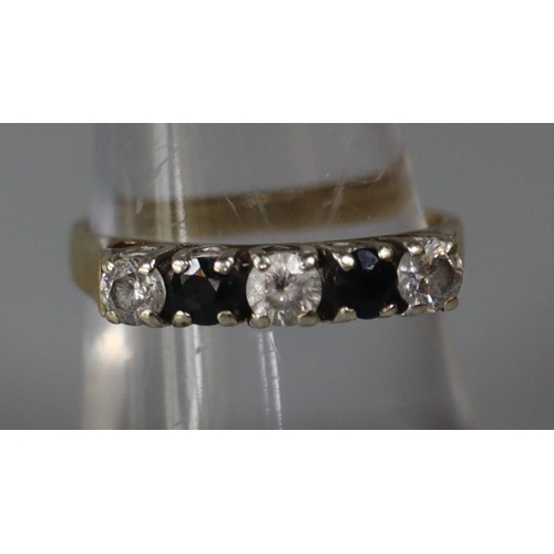 256 - 9ct gold sapphire and white stone ring.  Ring size N&1/2.  Approx weight 2.7 grams.
(B.P. 21% + VAT)