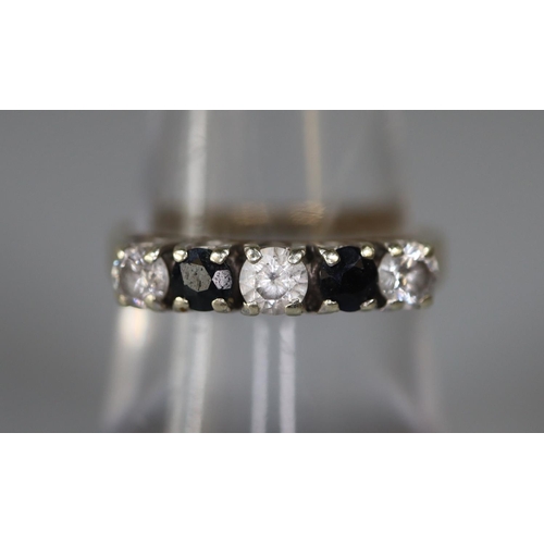 256 - 9ct gold sapphire and white stone ring.  Ring size N&1/2.  Approx weight 2.7 grams.
(B.P. 21% + VAT)