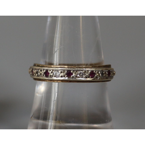 258 - 9ct gold half eternity ring set with rubies and cubic zirconas.  Ring size O.  Approx weight 2.6 gra... 