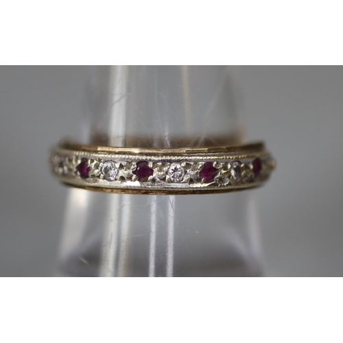 258 - 9ct gold half eternity ring set with rubies and cubic zirconas.  Ring size O.  Approx weight 2.6 gra... 