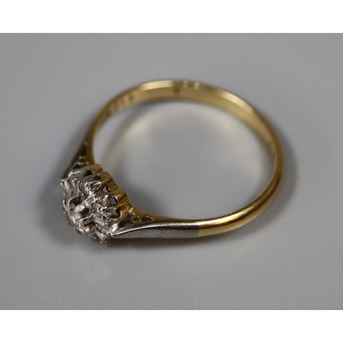 259 - 18ct gold and diamond cluster ring.  Ring size N.  Approx weight 2.3 grams.  
(B.P. 21% + VAT)