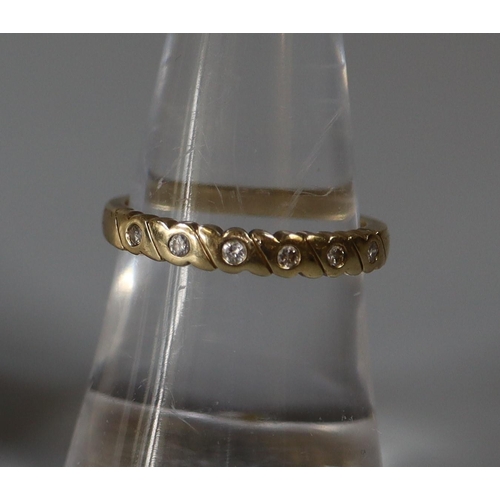 262 - 9ct gold and diamond half eternity ring.  Ring size N&1/2.  Approx weight 2.4 grams.
(B.P. 21% + VAT... 